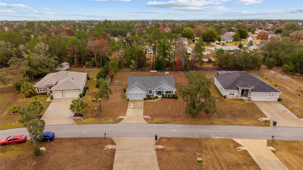 11275 Southwest 54th Circle Ocala, FL 34476 - Photo 49 of 63 an aerial view of residential houses with outdoor space