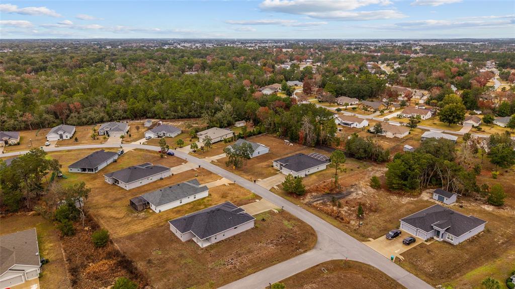 11275 Southwest 54th Circle Ocala, FL 34476 - Photo 52 of 63 an aerial view of residential houses with outdoor space
