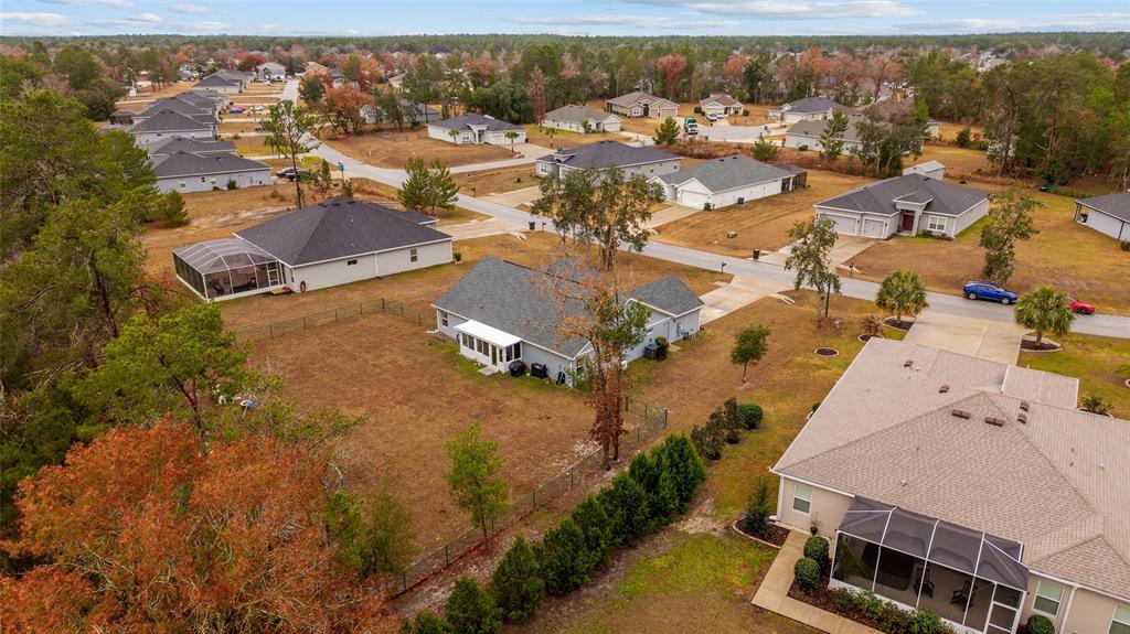 11275 Southwest 54th Circle Ocala, FL 34476 - Photo 57 of 63 an aerial view of residential houses with outdoor space