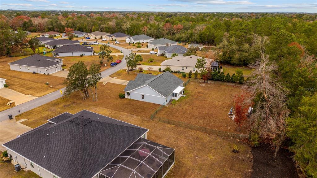 11275 Southwest 54th Circle Ocala, FL 34476 - Photo 58 of 63 an aerial view of residential houses with outdoor space