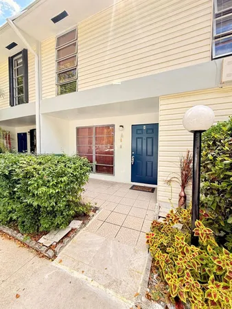 a view of a backyard with swimming pool