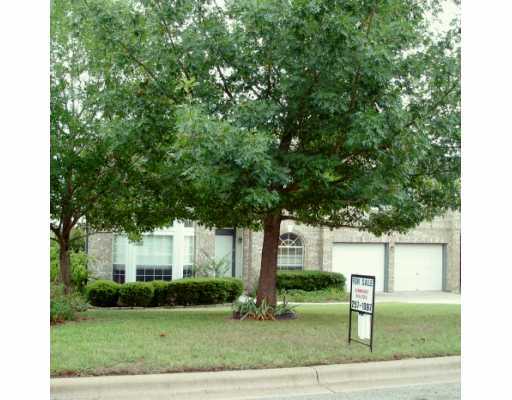 5906 Rickerhill Lane Austin, TX 78739 - Photo 1 of 1 a front view of a house with a yard