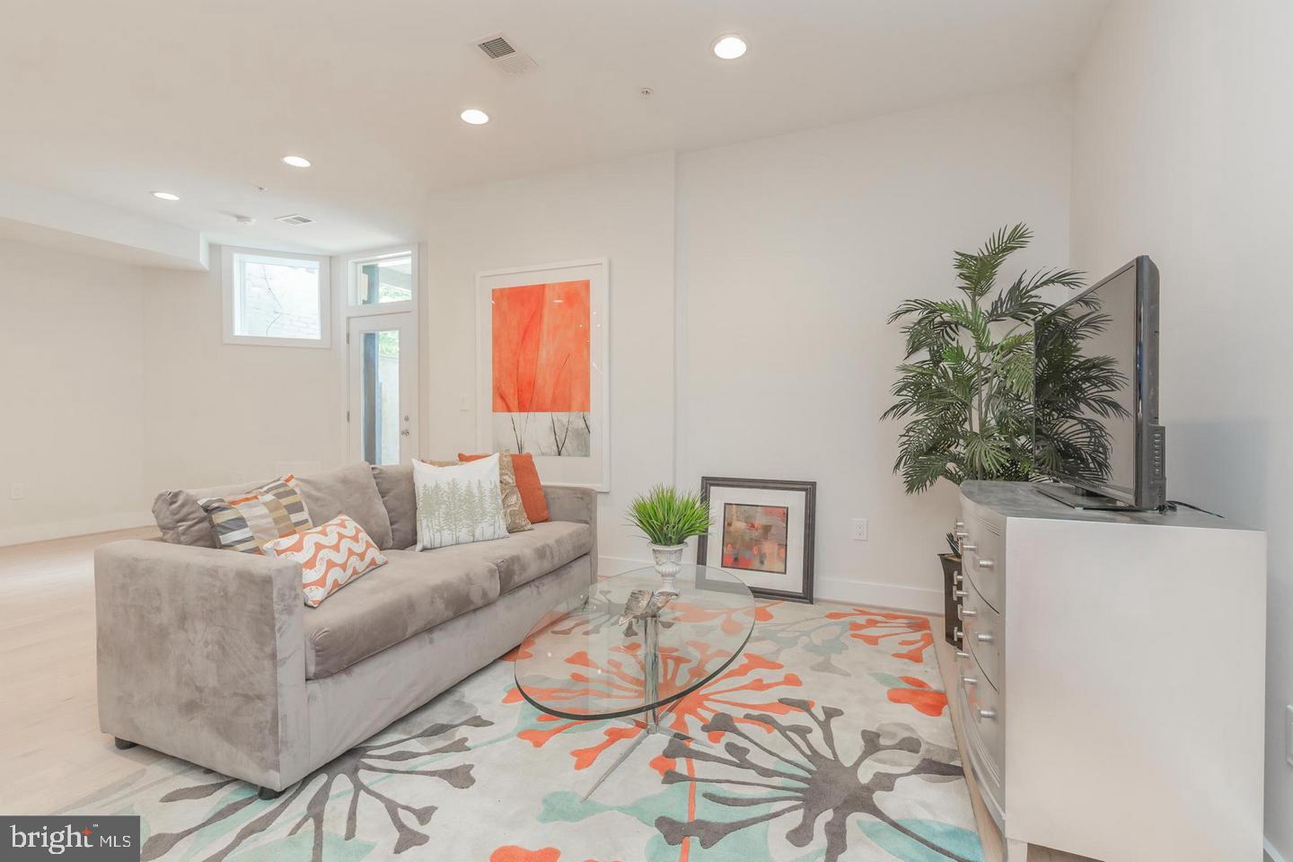 1352 Quincy Street Northwest, Unit 1 Washington, DC 20011 - Photo 11 of 26 a living room with furniture and a table