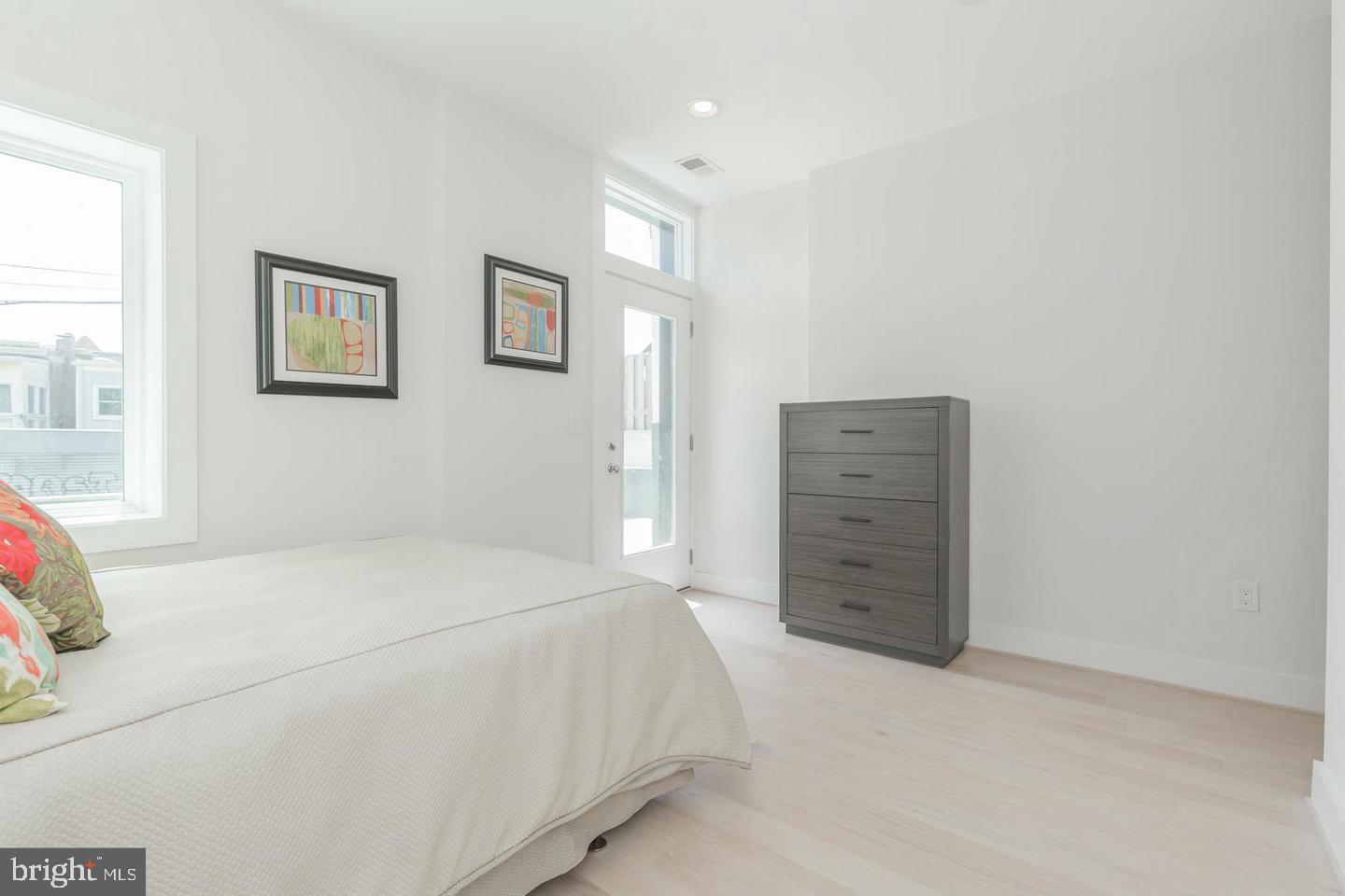 1352 Quincy Street Northwest, Unit 1 Washington, DC 20011 - Photo 17 of 26 a bedroom with a bed and a window