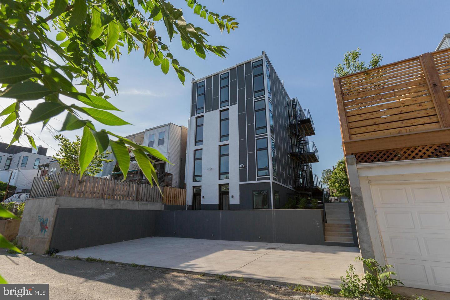 1352 Quincy Street Northwest, Unit 1 Washington, DC 20011 - Photo 18 of 26 a view of building along with street