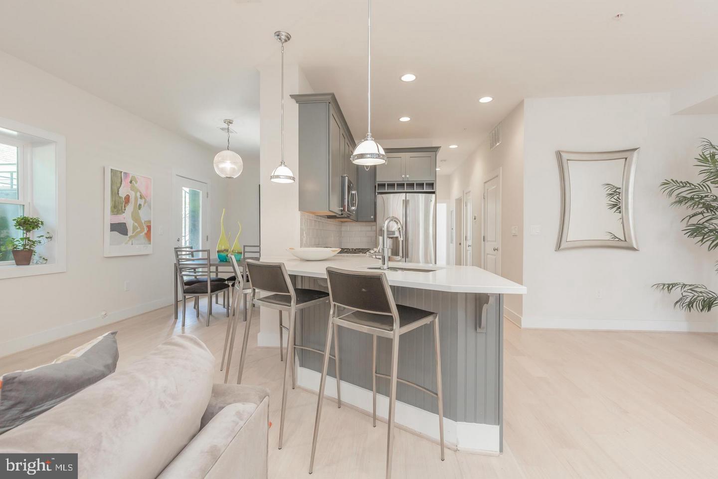1352 Quincy Street Northwest, Unit 1 Washington, DC 20011 - Photo 2 of 26 a dining room with furniture and a chandelier