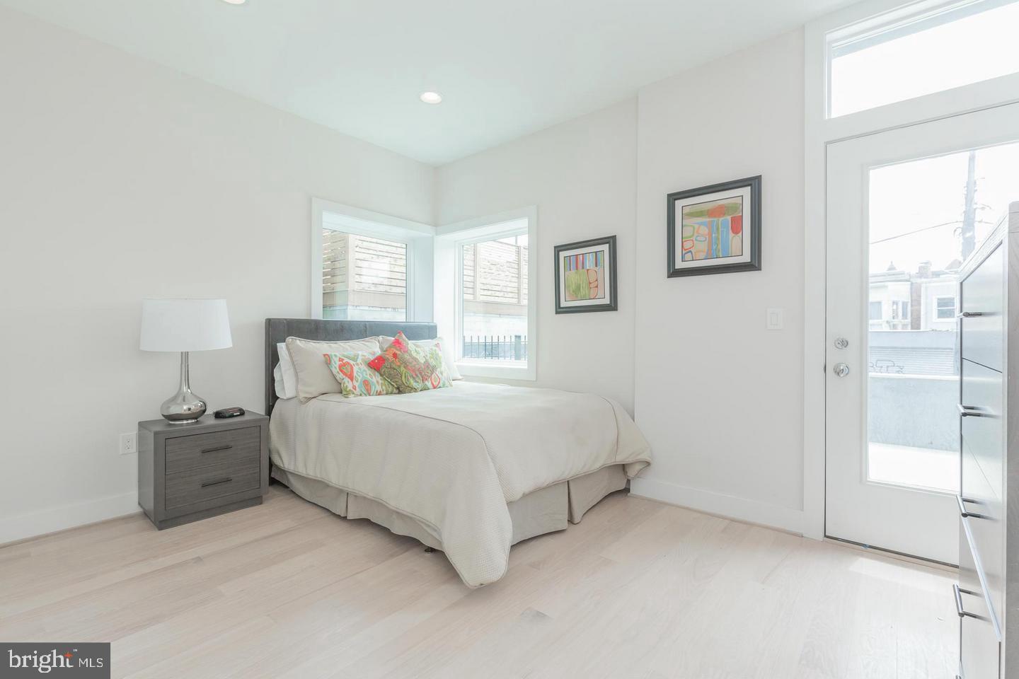 1352 Quincy Street Northwest, Unit 1 Washington, DC 20011 - Photo 25 of 26 a bedroom with a bed and a night stand