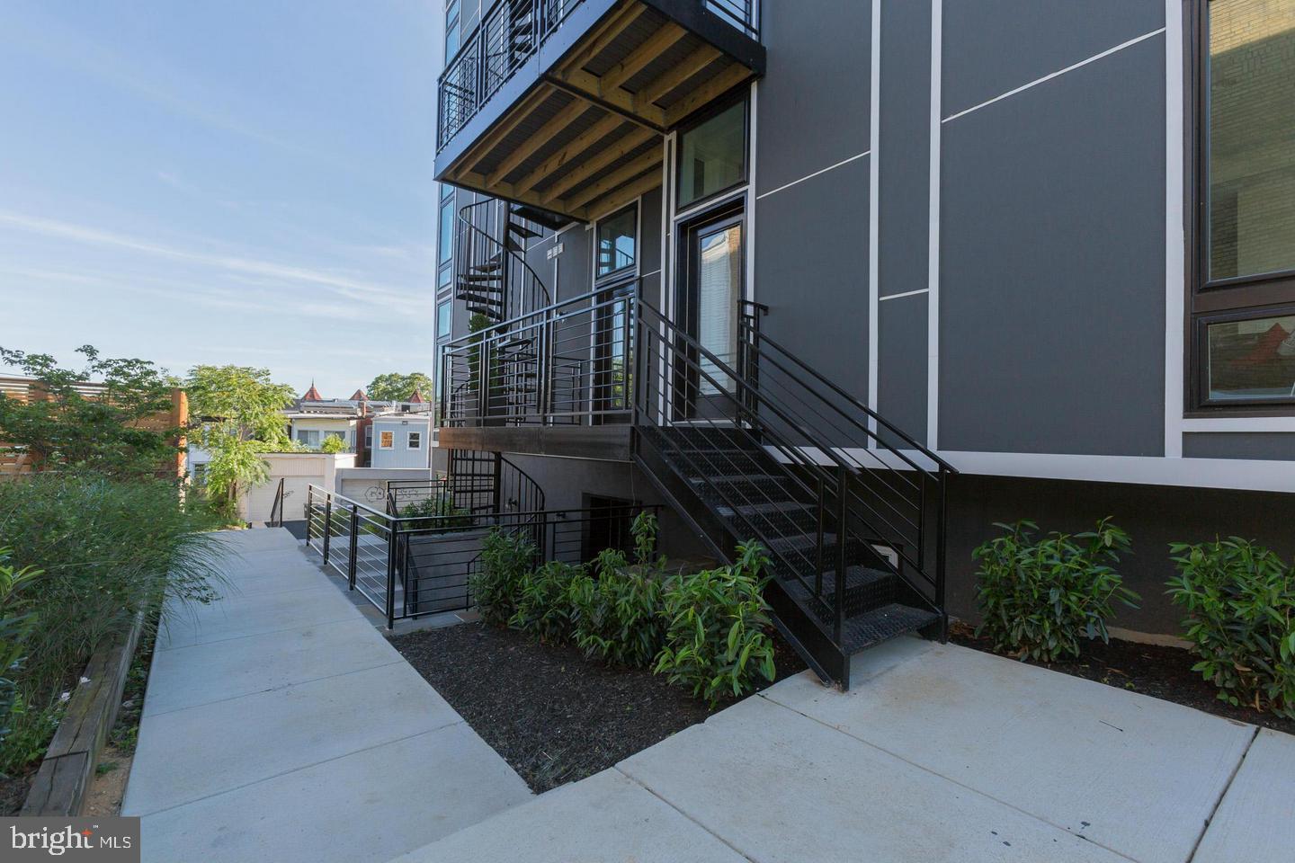 1352 Quincy Street Northwest, Unit 1 Washington, DC 20011 - Photo 26 of 26 a view of a patio with couches and table and chairs and potted plants
