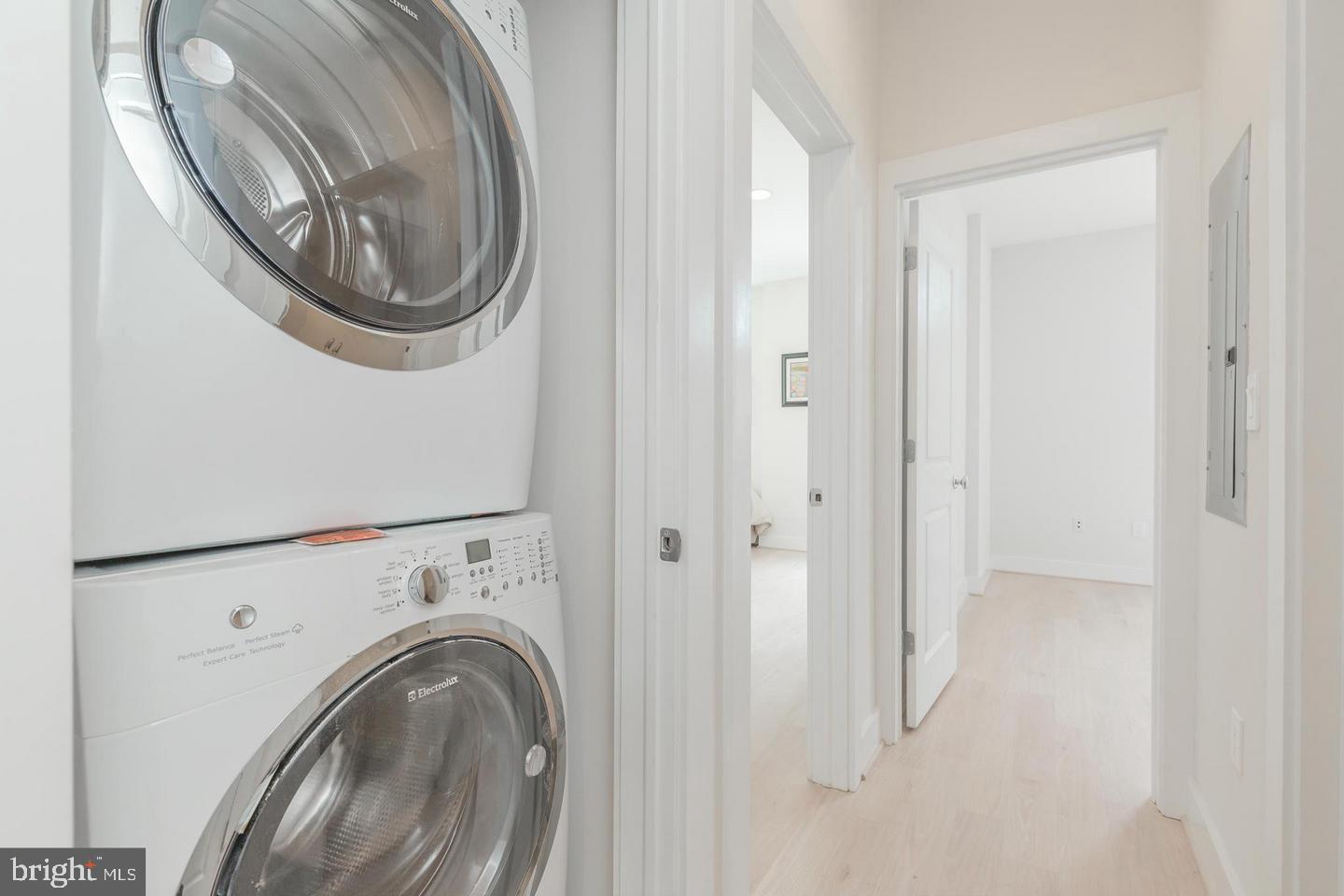 1352 Quincy Street Northwest, Unit 1 Washington, DC 20011 - Photo 3 of 26 a view of a hallway with washer and dryer