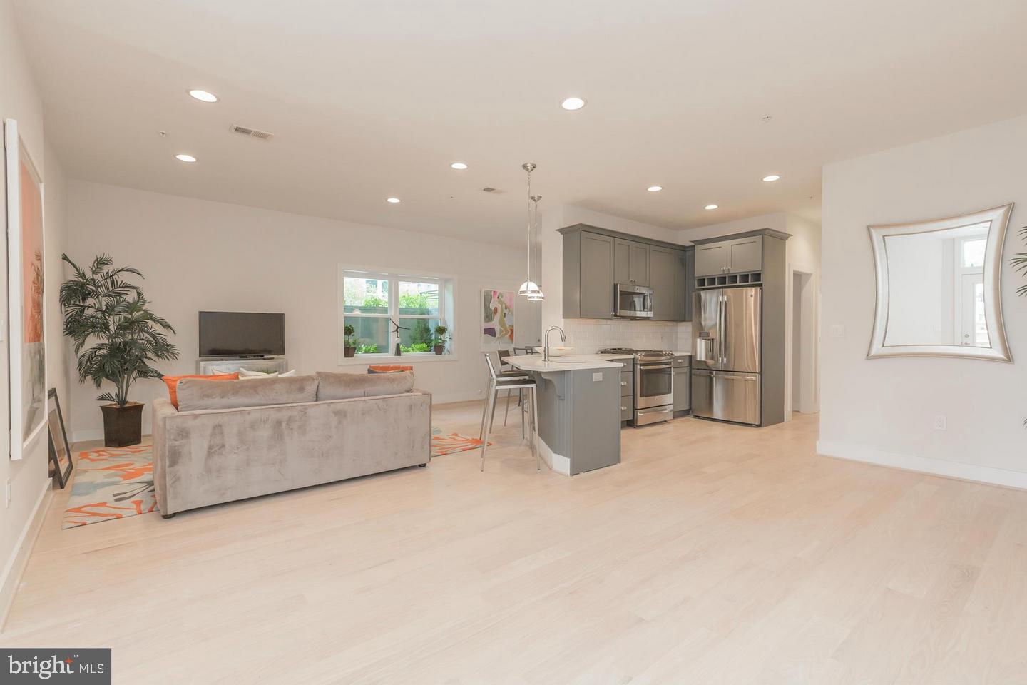 1352 Quincy Street Northwest, Unit 1 Washington, DC 20011 - Photo 6 of 26 a living room with furniture and a flat screen tv