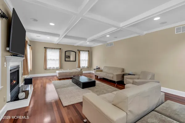 a kitchen with stainless steel appliances granite countertop wooden cabinets a sink and a stove