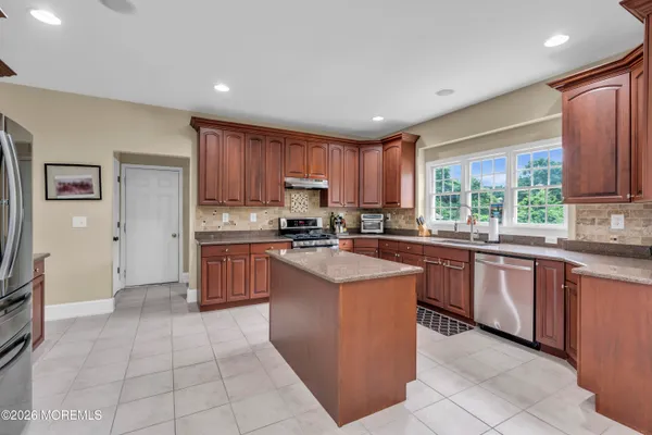 a view of entryway with wooden floor and stairs
