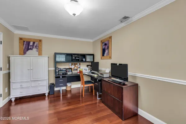 a balcony with furniture and a ceiling fan