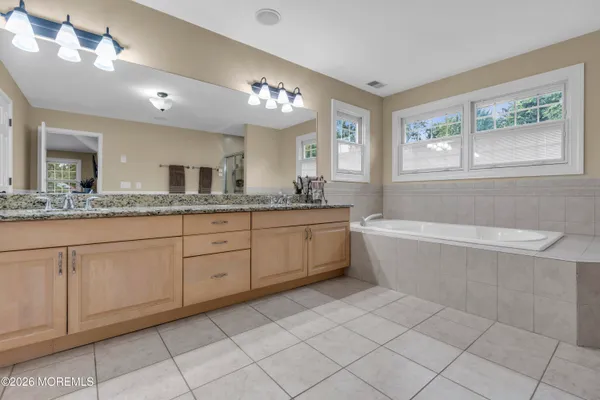 a view of a patio with a table chairs and a backyard