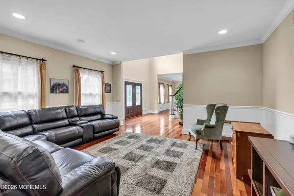 a living room with furniture large window and a fireplace