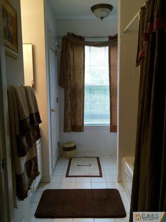 35 Inverness Drive Edison, NJ 08820 - Photo 11 of 15 a view of walk in closet with clothes and shoes