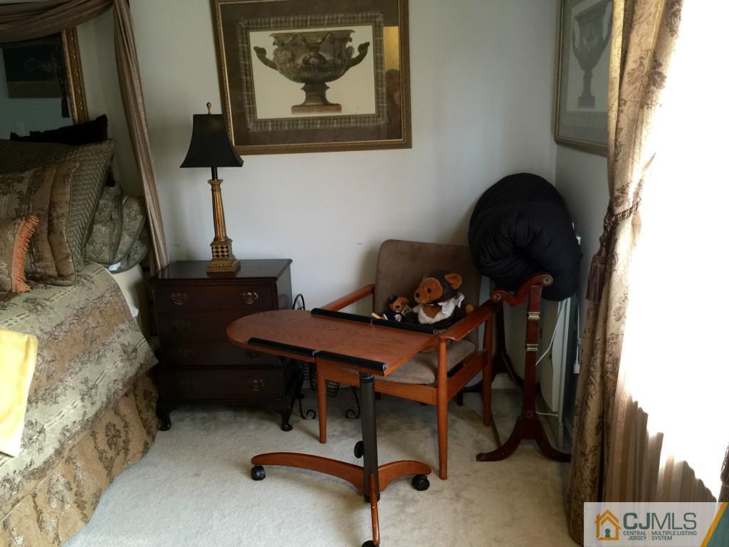 35 Inverness Drive Edison, NJ 08820 - Photo 9 of 15 a room with furniture and a fireplace