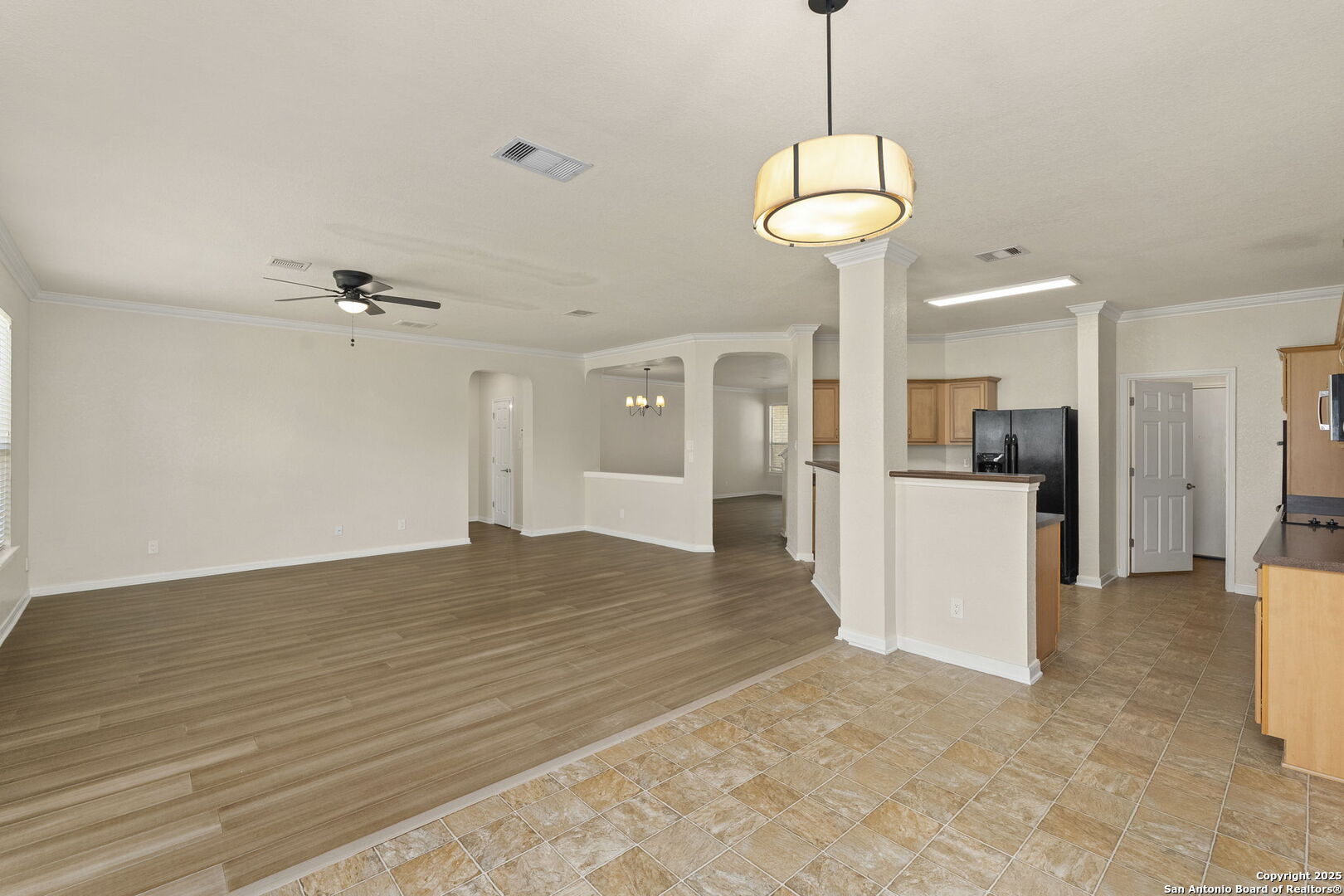 213 Springtree Parkway Cibolo, TX 78108 - Photo 14 of 33 a view of a kitchen with a refrigerator and a stove