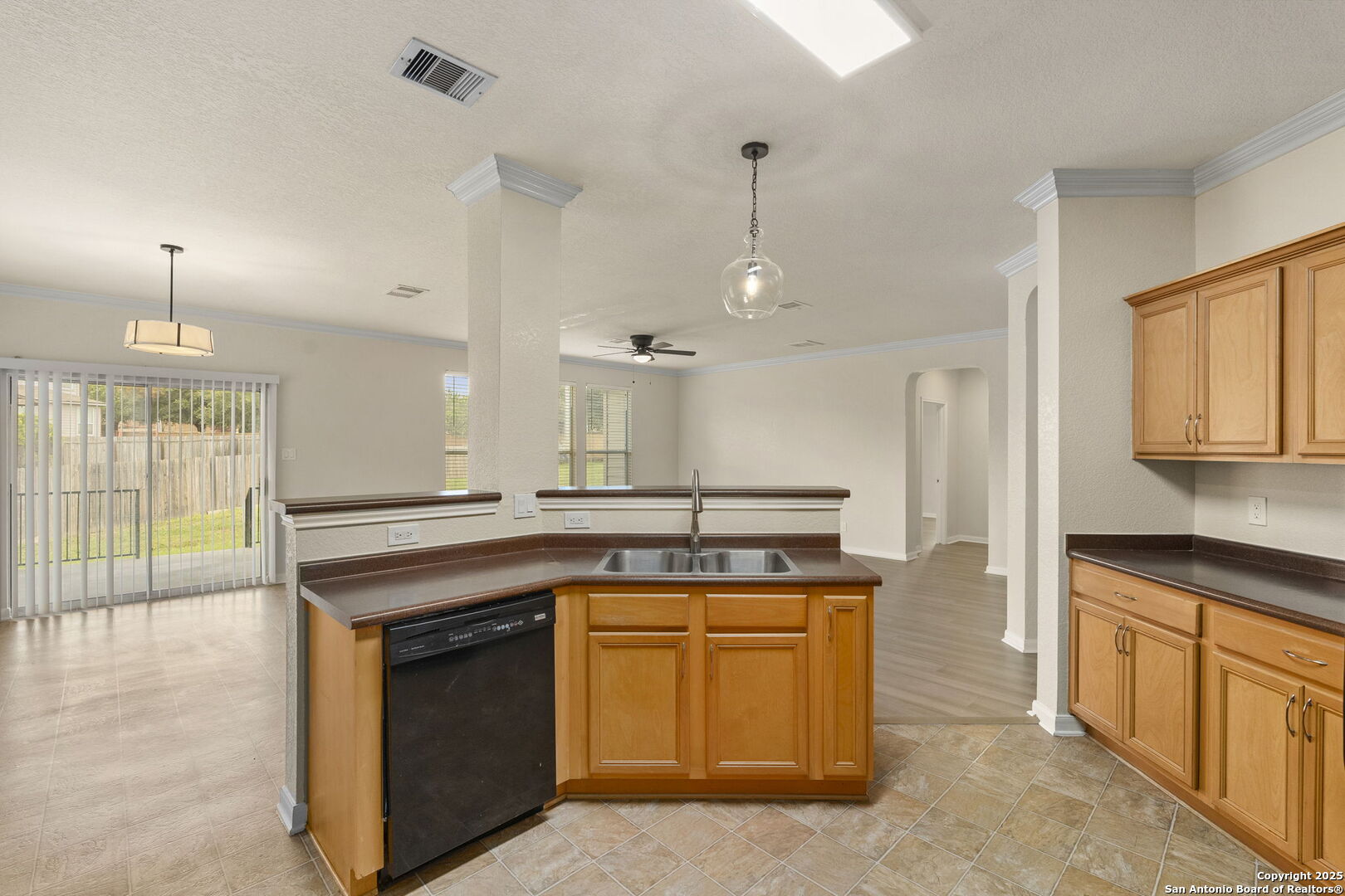 213 Springtree Parkway Cibolo, TX 78108 - Photo 16 of 33 a kitchen with a stove and a sink