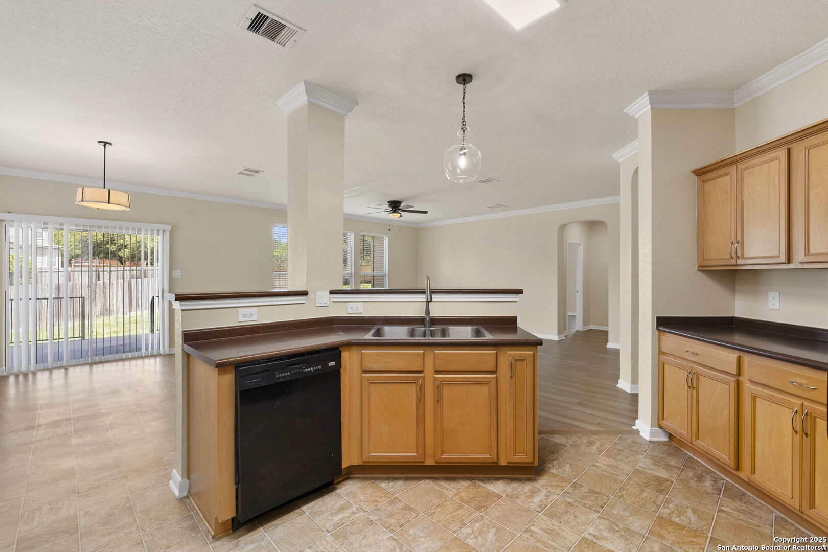 213 Springtree Parkway Cibolo, TX 78108 - Photo 17 of 33 a kitchen with stainless steel appliances granite countertop a stove a sink and a refrigerator