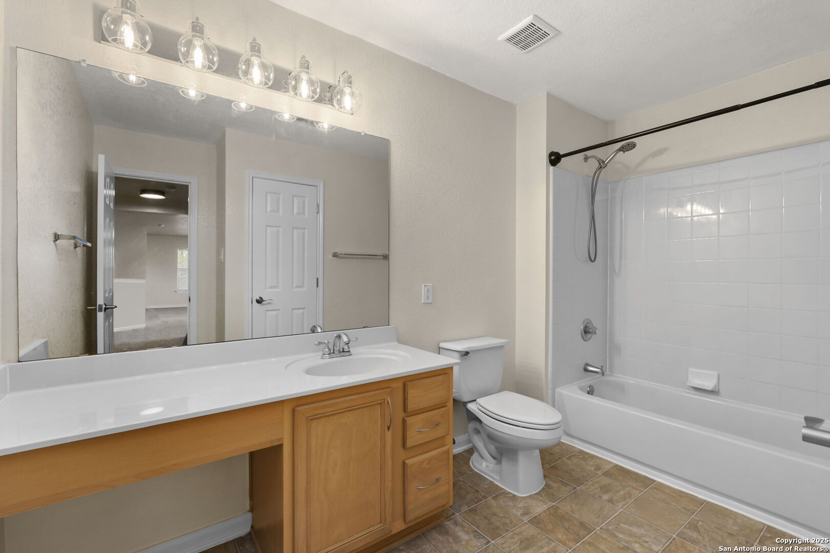 213 Springtree Parkway Cibolo, TX 78108 - Photo 27 of 33 a bathroom with a sink a toilet and shower