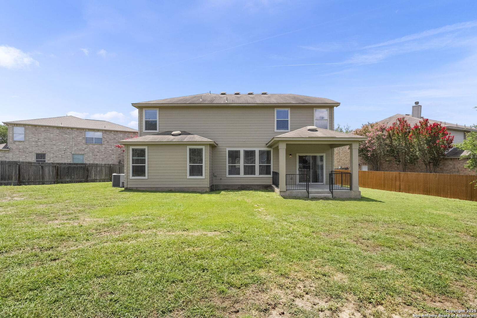 213 Springtree Parkway Cibolo, TX 78108 - Photo 32 of 33 a front view of a house with garden