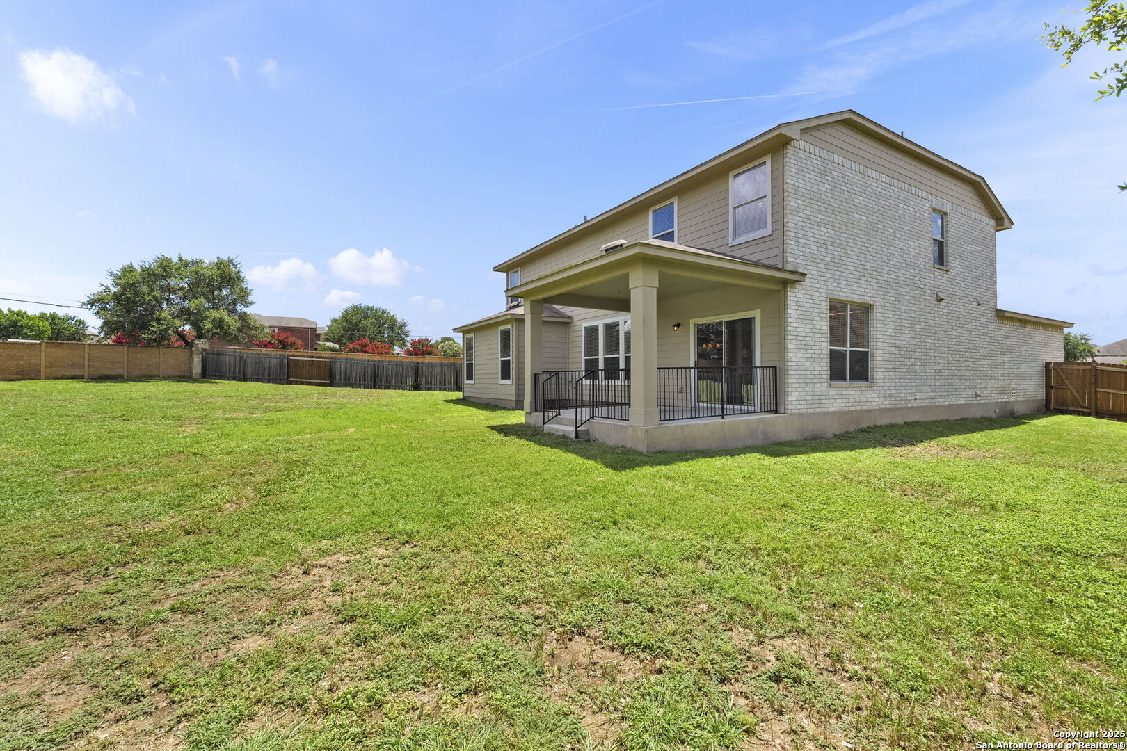 213 Springtree Parkway Cibolo, TX 78108 - Photo 33 of 33 a view of a house with a yard