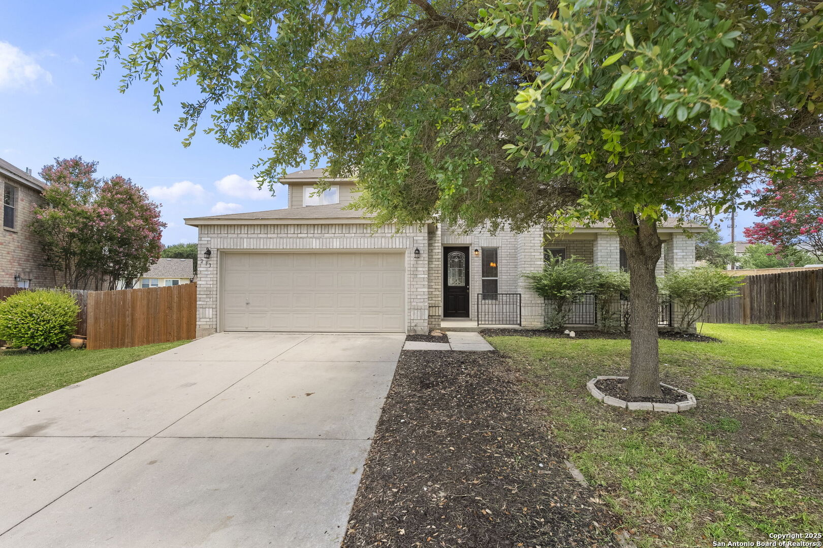 213 Springtree Parkway Cibolo, TX 78108 - Photo 6 of 33 a front view of a house with a yard and tree
