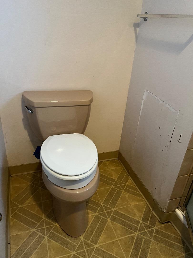 128 Laumer Avenue San Jose, CA 95127 - Photo 11 of 18 a toilet sitting in a bathroom next to a sink