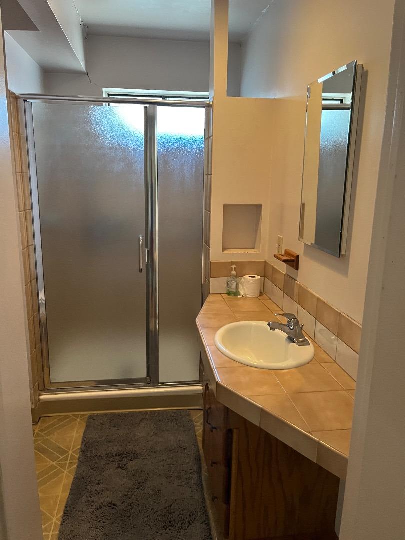 128 Laumer Avenue San Jose, CA 95127 - Photo 13 of 18 a bathroom with a sink and a mirror