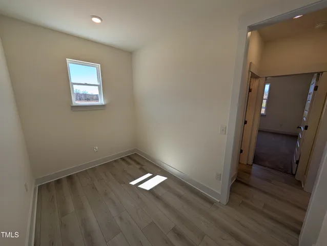 a view of empty room with windows