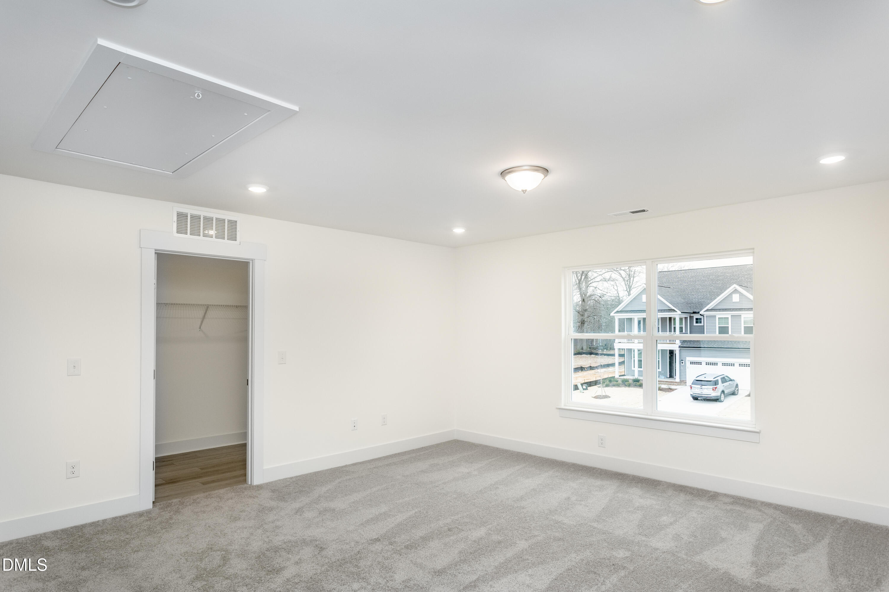 143 Steppe Way Garner, NC 27529 - Photo 23 of 38 an empty room with windows and mountain view