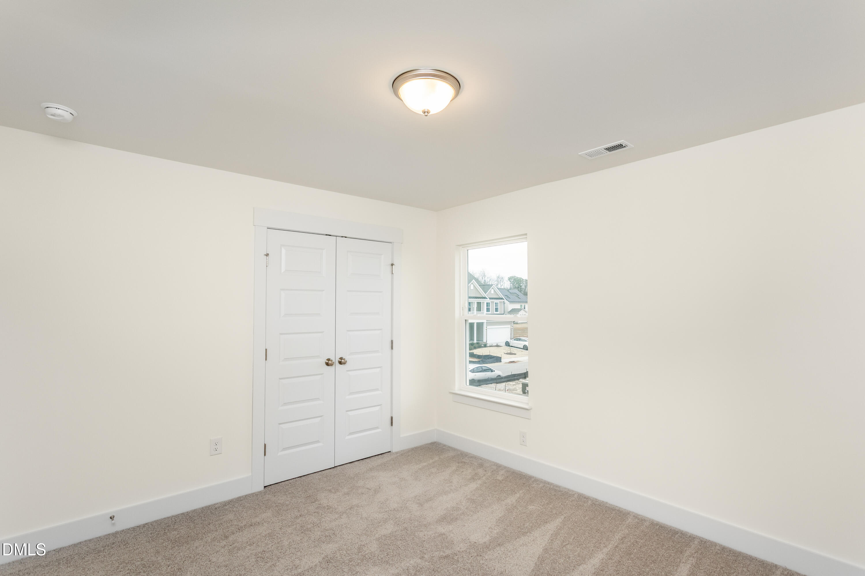143 Steppe Way Garner, NC 27529 - Photo 27 of 38 an empty room with windows