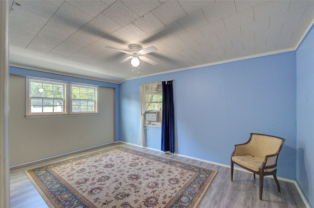 5064 Keowee School Road Seneca, SC 29672 - Photo 36 of 49 This spacious bedroom offers ample natural light and a comfortable atmosphere for rest and relaxation.