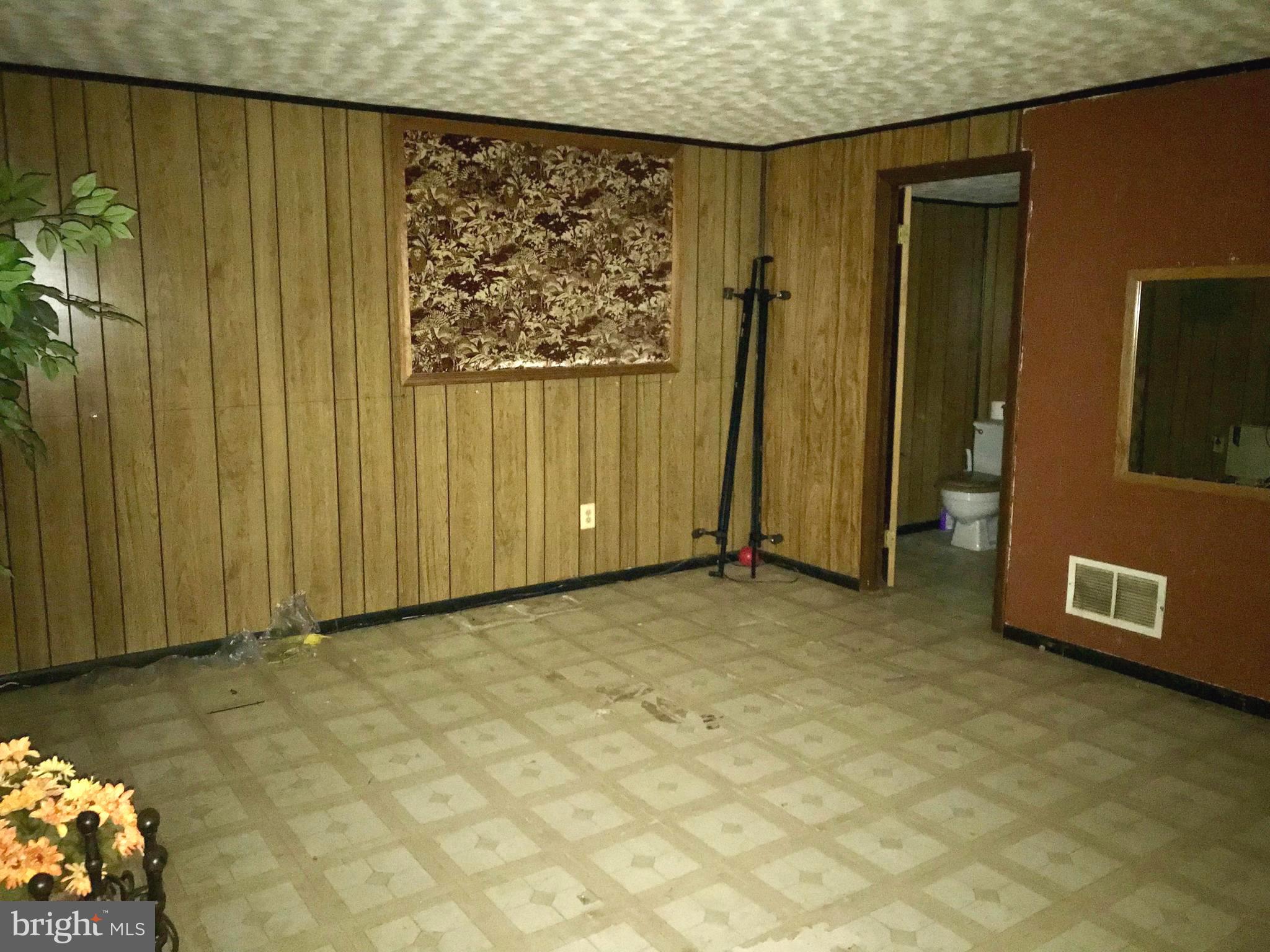 20 Lockett Court Baltimore, MD 21221 - Photo 22 of 31 Family Room with attached Half Bath (lower level)