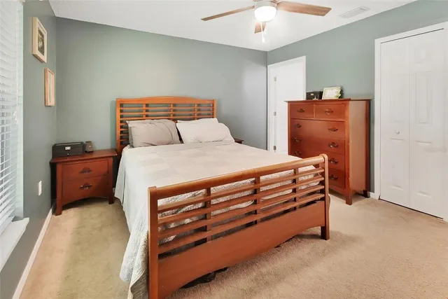 a bedroom with a bed and a dresser