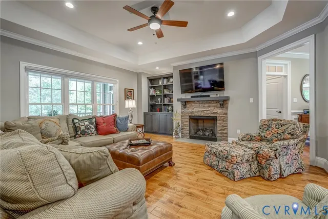 a living room with furniture fireplace and flat screen tv