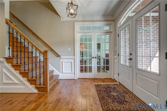 a view of an entryway with wooden floor