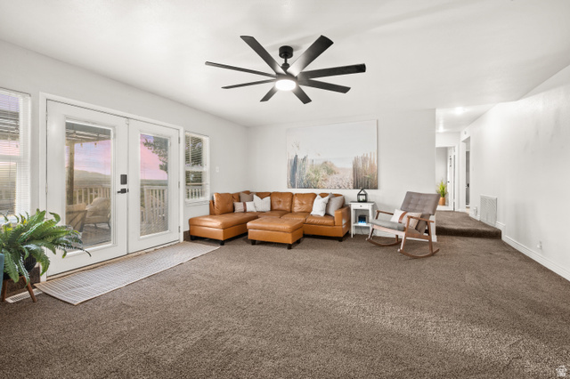 9750 Indian Ridge Drive Sandy, UT 84092 - Photo 32 of 40 Carpeted living area featuring french doors and a ceiling fan