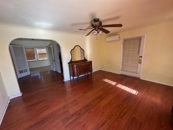 a view of a livingroom with furniture and wooden floor