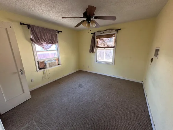 a bathroom with a sink and mirror with toilet