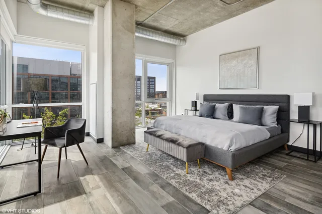 a terrace with outdoor seating and city view