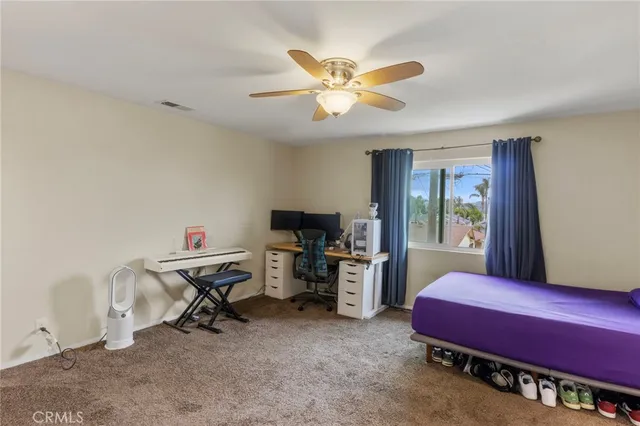 a bedroom with furniture and a window