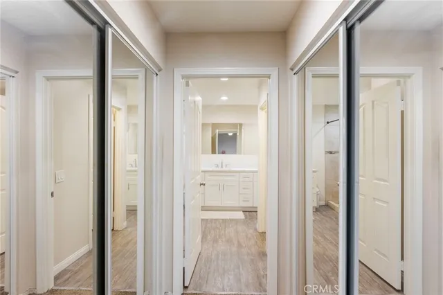 a view of a bathroom from a hallway