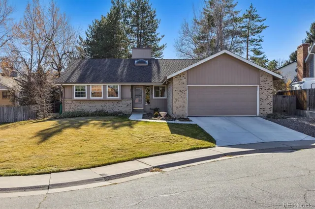 a view of house with yard