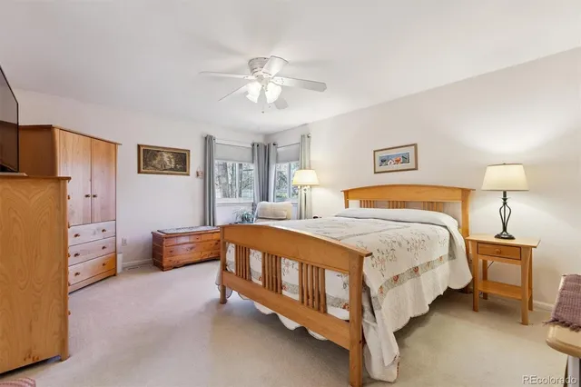 a bedroom with bed and window