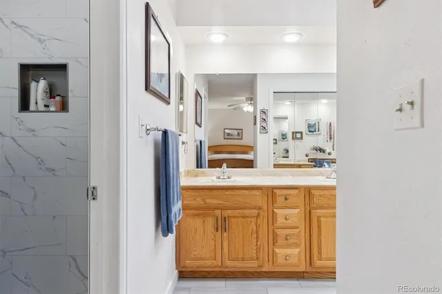 a kitchen with stainless steel appliances granite countertop a refrigerator and a stove