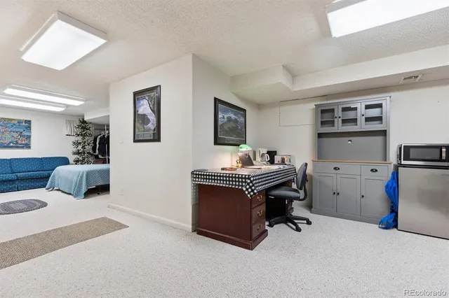 a view of a livingroom with furniture and a flat screen tv