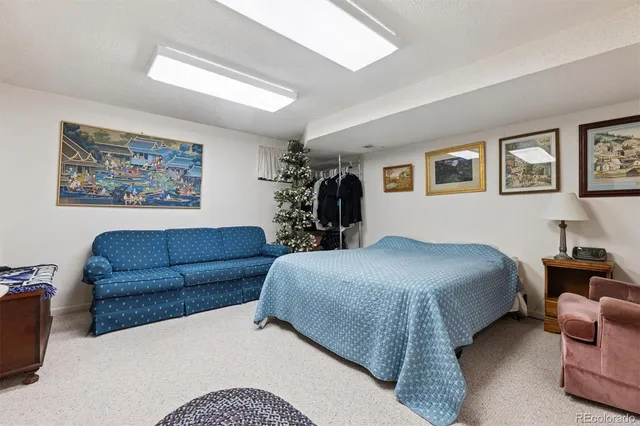 a bedroom with furniture and a chandelier