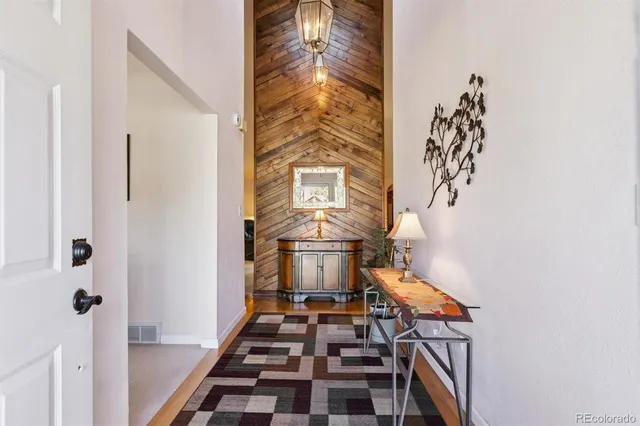 a view of a hallway with front door